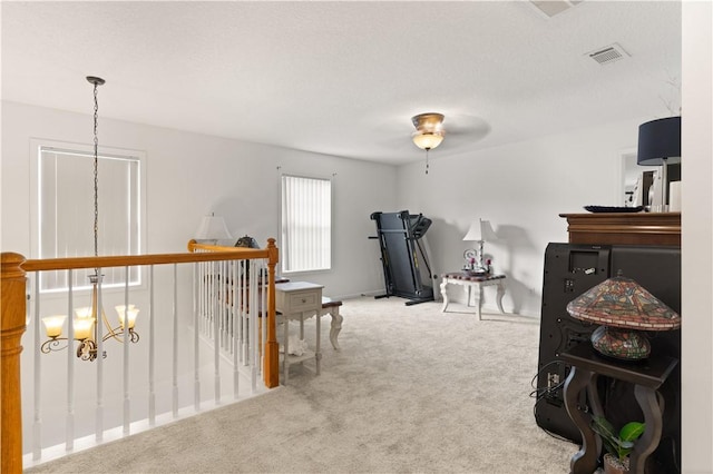114 Shell Pointe Dr, Brunswick, GA 31525 - miscellaneous room with carpet and ceiling fan with notable chandelier