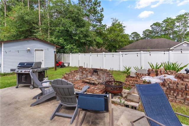 114 Shell Pointe Dr, Brunswick, GA 31525 - view of patio featuring an outbuilding and area for grilling