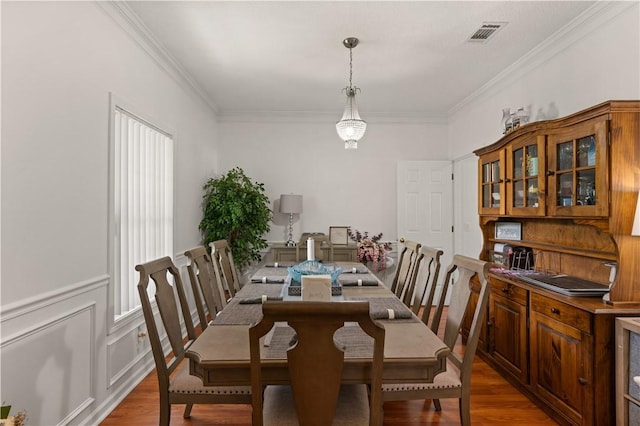 114 Shell Pointe Dr, Brunswick, GA 31525 - dining room featuring hardwood / wood-style floors and crown molding