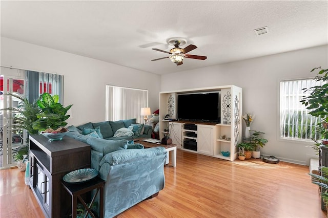 114 Shell Pointe Dr, Brunswick, GA 31525 - living room featuring ceiling fan, wood-type flooring, and a textured ceiling