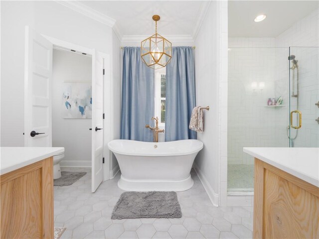 904 Champney, Saint Simons Island, GA 31522 - full bath featuring a stall shower, a freestanding bath, ornamental molding, vanity, and tile patterned flooring