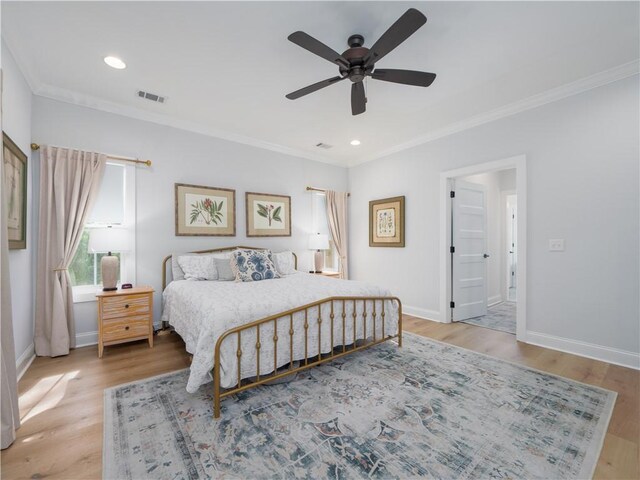 904 Champney, Saint Simons Island, GA 31522 - bedroom featuring crown molding, light wood-type flooring, recessed lighting, and a ceiling fan