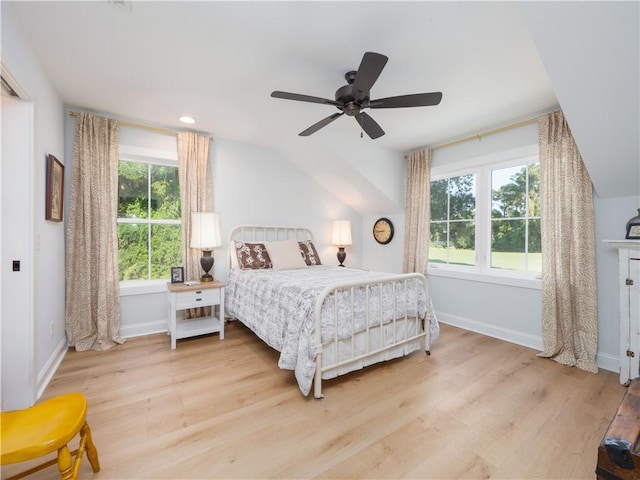 904 Champney, Saint Simons Island, GA 31522 - bedroom with light wood finished floors, lofted ceiling, and ceiling fan
