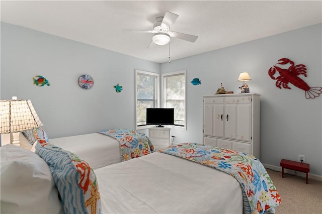 bedroom with ceiling fan and carpet floors