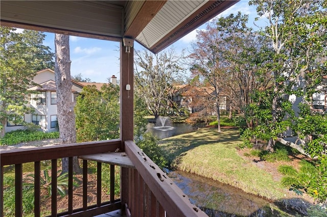 balcony featuring a water view