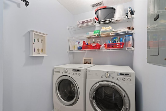 laundry room featuring washer and clothes dryer