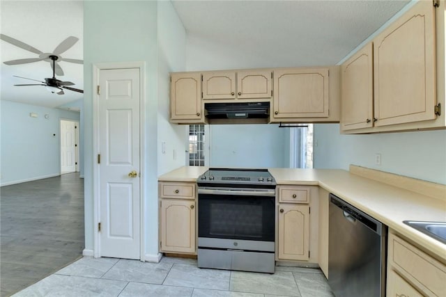 kitchen featuring appliances with stainless steel finishes, ceiling fan, light brown cabinetry, and extractor fan