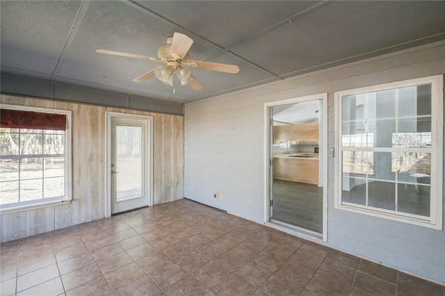 interior space featuring ceiling fan