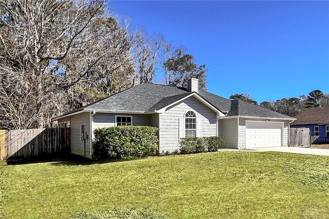 ranch-style home with a front yard and a garage