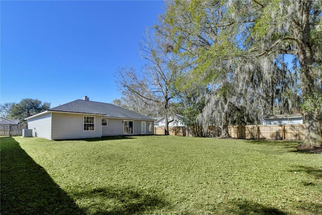 view of yard featuring central AC