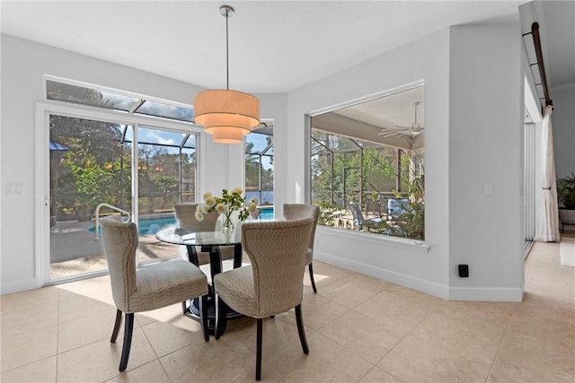 dining room featuring plenty of natural light and light tile patterned flooring