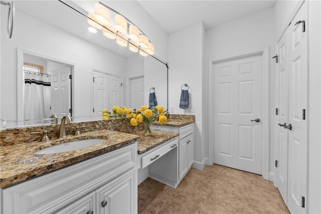 bathroom with vanity and tile patterned floors