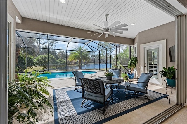 view of patio / terrace with ceiling fan and glass enclosure