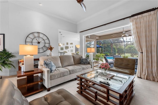 carpeted living room featuring ceiling fan and ornamental molding