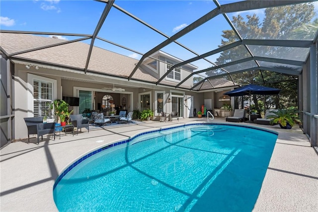 view of swimming pool with a lanai and a patio area