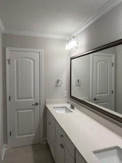 bathroom with vanity and ornamental molding