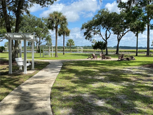 view of home's community with a yard