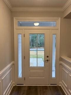 entryway featuring dark hardwood / wood-style flooring and ornamental molding