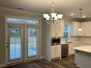 kitchen featuring dark wood-type flooring, sink, decorative light fixtures, white cabinetry, and stainless steel appliances