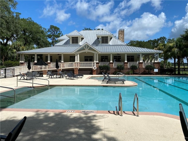 view of swimming pool with a patio