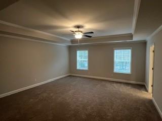 unfurnished room with ceiling fan, carpet floors, and crown molding