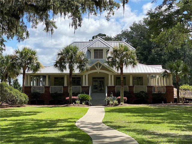 view of front facade with covered porch and a front lawn