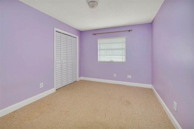 spare room with light carpet