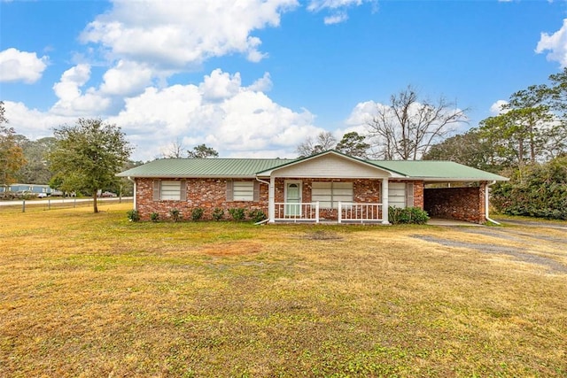 single story home with a front yard, a porch, and a carport