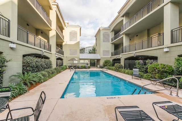 150 Salt Air Dr Unit 202, Saint Simons Island, GA 31522 - community pool featuring a patio