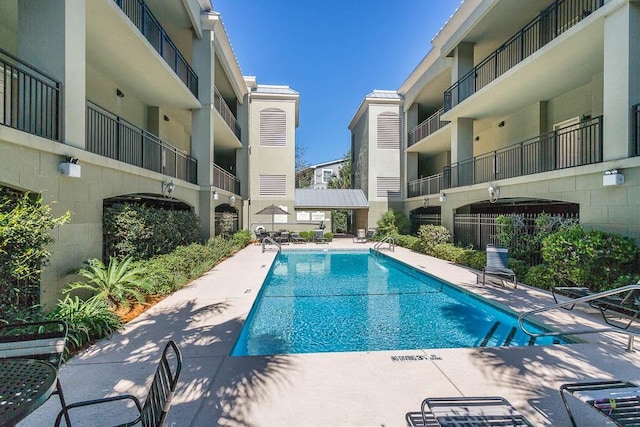 150 Salt Air Dr Unit 202, Saint Simons Island, GA 31522 - community pool featuring a patio area