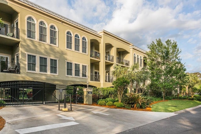 150 Salt Air Dr Unit 202, Saint Simons Island, GA 31522 - view of property with concrete driveway