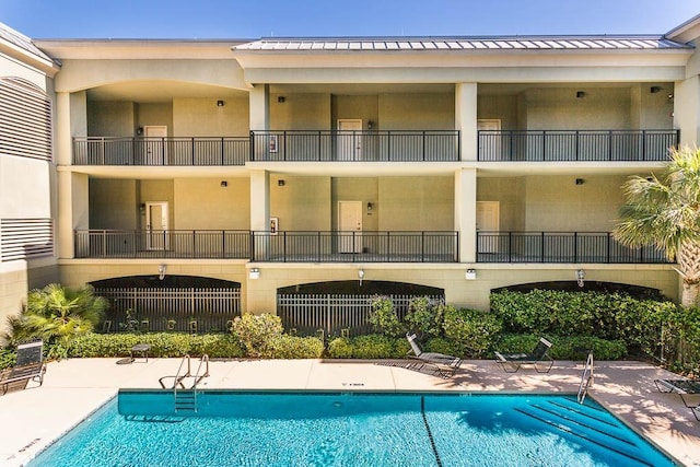 150 Salt Air Dr Unit 202, Saint Simons Island, GA 31522 - community pool featuring a patio area