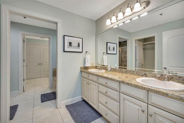 150 Salt Air Dr Unit 202, Saint Simons Island, GA 31522 - full bathroom with double vanity, a tile shower, and tile patterned floors