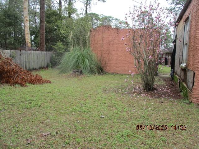 view of yard with fence
