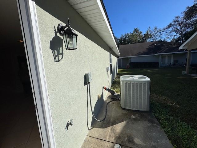 exterior details with central air condition unit