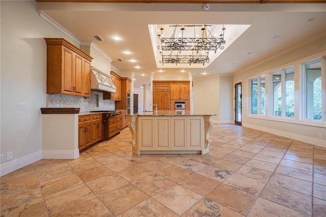 178 Hampton Point Dr, Saint Simons Island, GA 31522 - kitchen featuring ornamental molding, backsplash, a chandelier, an island with sink, and recessed lighting