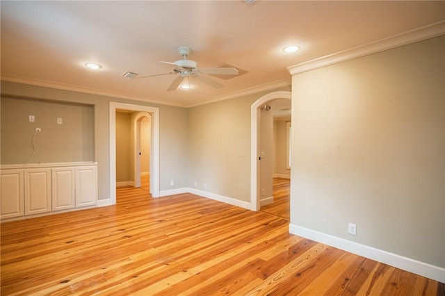 178 Hampton Point Dr, Saint Simons Island, GA 31522 - empty room with arched walkways, crown molding, ceiling fan, light wood-style floors, and recessed lighting
