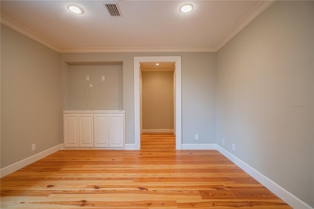 178 Hampton Point Dr, Saint Simons Island, GA 31522 - empty room with crown molding, light wood finished floors, and recessed lighting