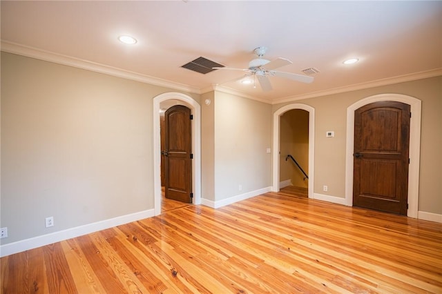 178 Hampton Point Dr, Saint Simons Island, GA 31522 - unfurnished room with arched walkways, ornamental molding, ceiling fan, recessed lighting, and light wood-style flooring