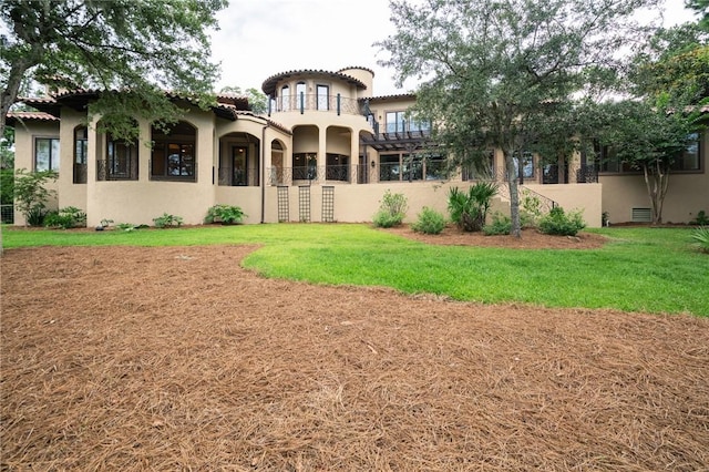 178 Hampton Point Dr, Saint Simons Island, GA 31522 - rear view of house with stucco siding and a tiled roof