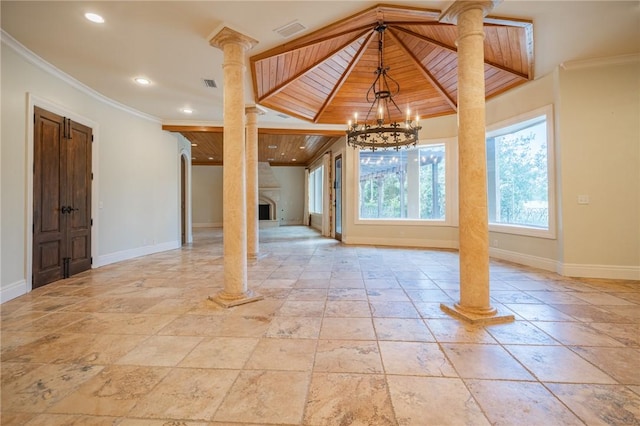 178 Hampton Point Dr, Saint Simons Island, GA 31522 - foyer with ornamental molding, recessed lighting, a chandelier, decorative columns, and stone tile flooring