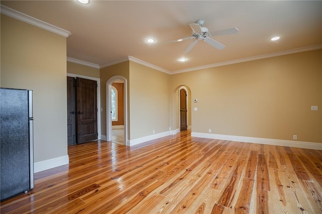 178 Hampton Point Dr, Saint Simons Island, GA 31522 - empty room featuring arched walkways, light wood-style floors, a ceiling fan, ornamental molding, and recessed lighting