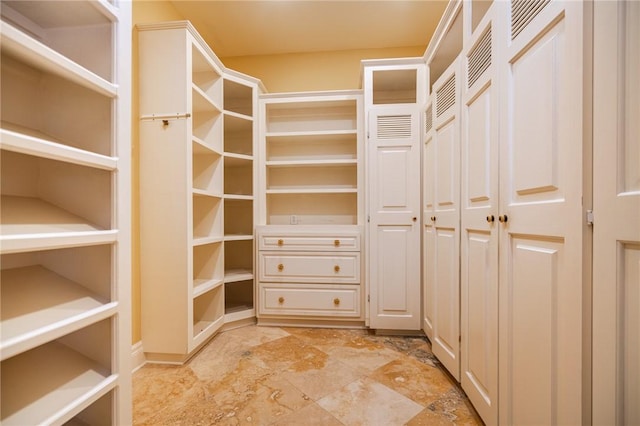 178 Hampton Point Dr, Saint Simons Island, GA 31522 - spacious closet featuring light stone finish floors