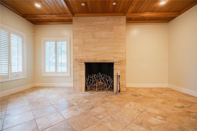 178 Hampton Point Dr, Saint Simons Island, GA 31522 - unfurnished living room with a wooden ceiling with exposed beams, recessed lighting, and a tiled fireplace