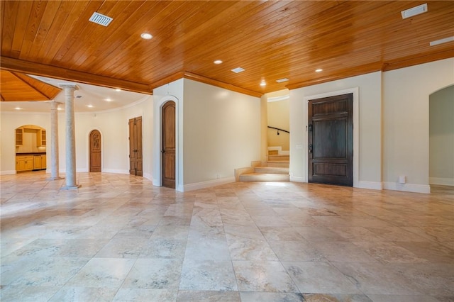 178 Hampton Point Dr, Saint Simons Island, GA 31522 - unfurnished room with arched walkways, wooden ceiling, crown molding, decorative columns, and stairs