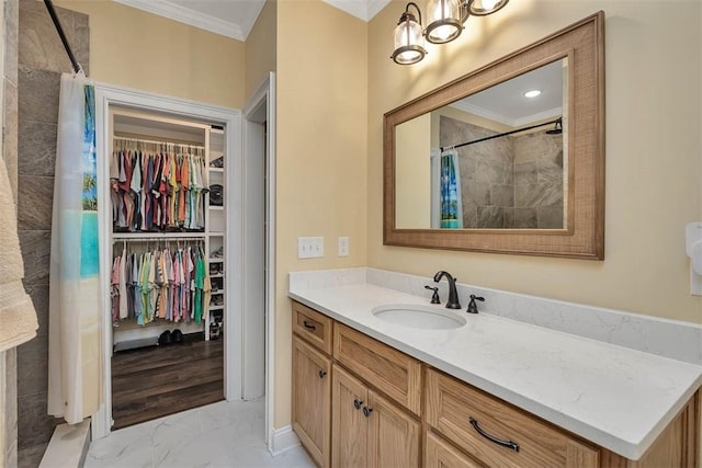 bathroom with vanity, crown molding, and a shower with curtain