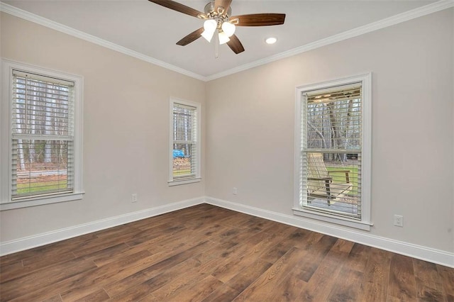 spare room with crown molding, ceiling fan, and dark hardwood / wood-style floors