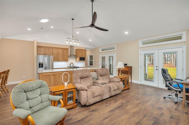 living room featuring sink, ceiling fan, dark hardwood / wood-style flooring, vaulted ceiling, and french doors