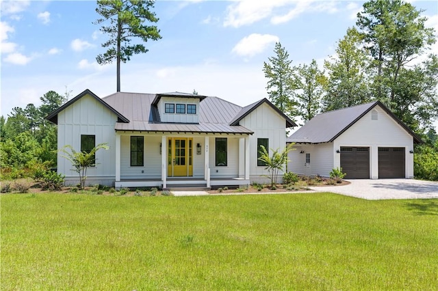 modern farmhouse style home featuring a garage, a front yard, and a porch