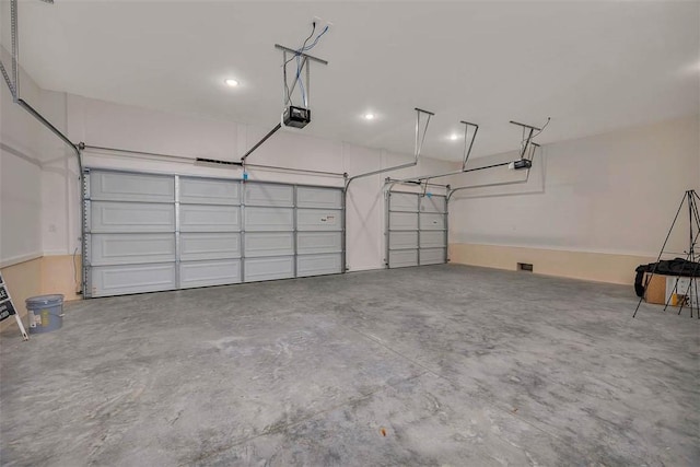 128 W Point Pkwy, Saint Simons Island, GA 31522 - garage featuring a garage door opener and recessed lighting